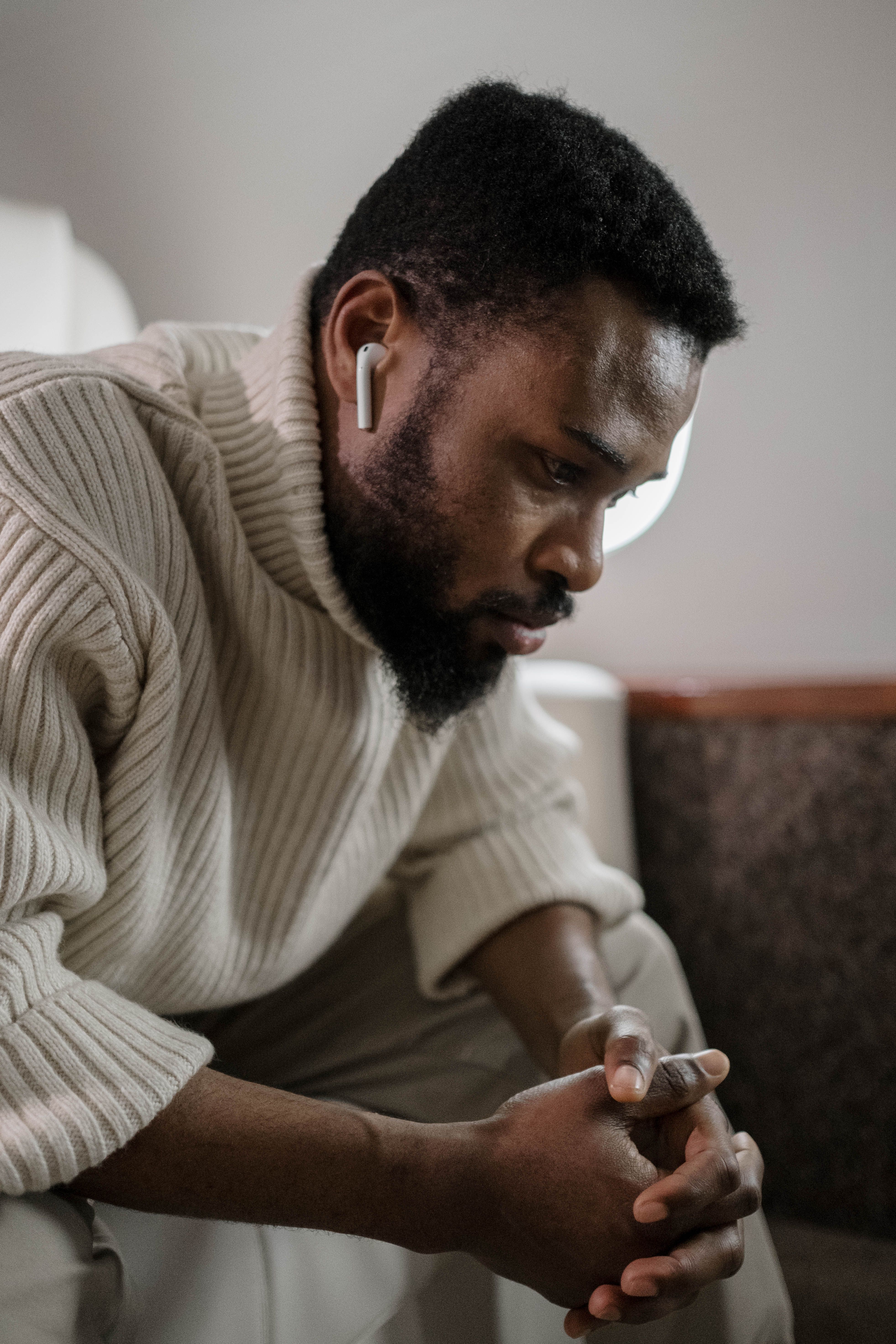 Man wearing wireless earbuds outdoors